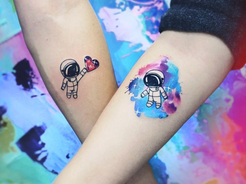 Astronauts couple tattoo design