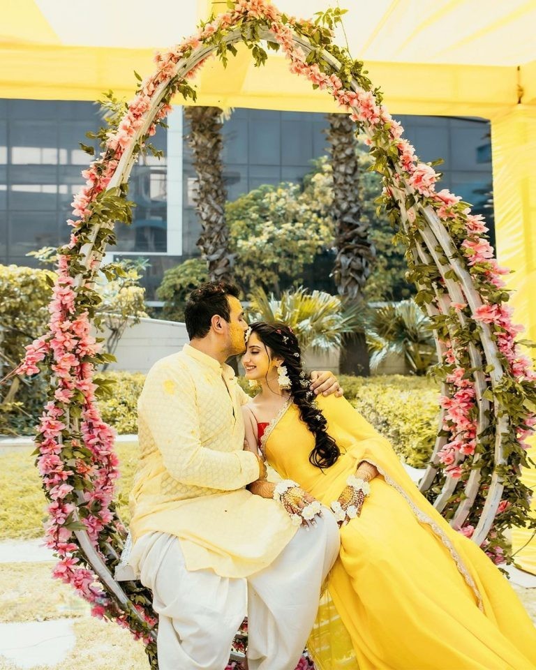 forehead kiss - haldi poses for bride and groom