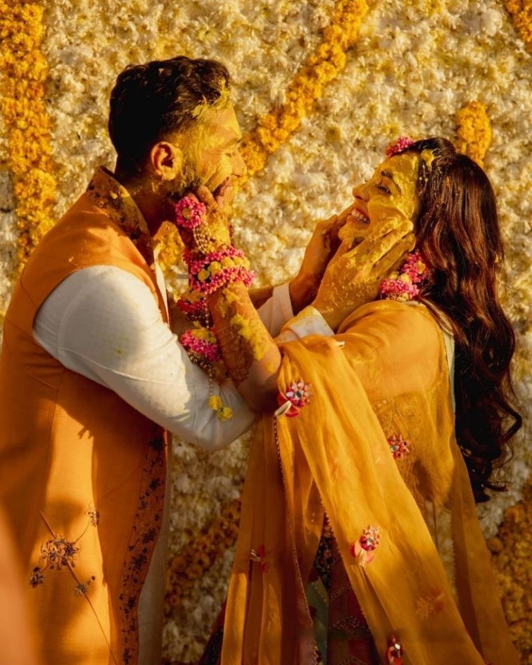 applying haldi - haldi poses for bride and groom