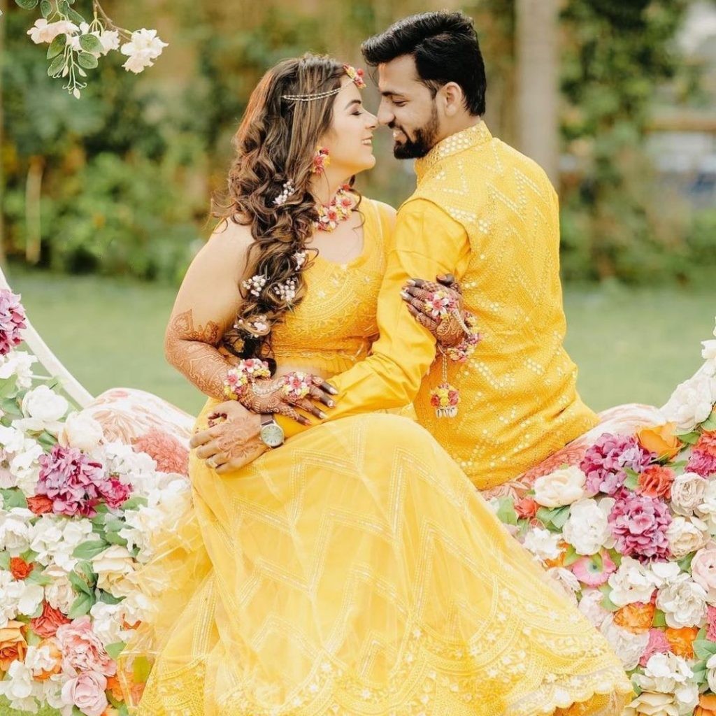 intimate pose on a bench - haldi poses for bride and groom