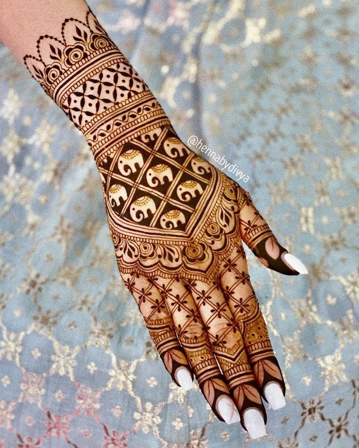 tiny elephants back hand mehndi design