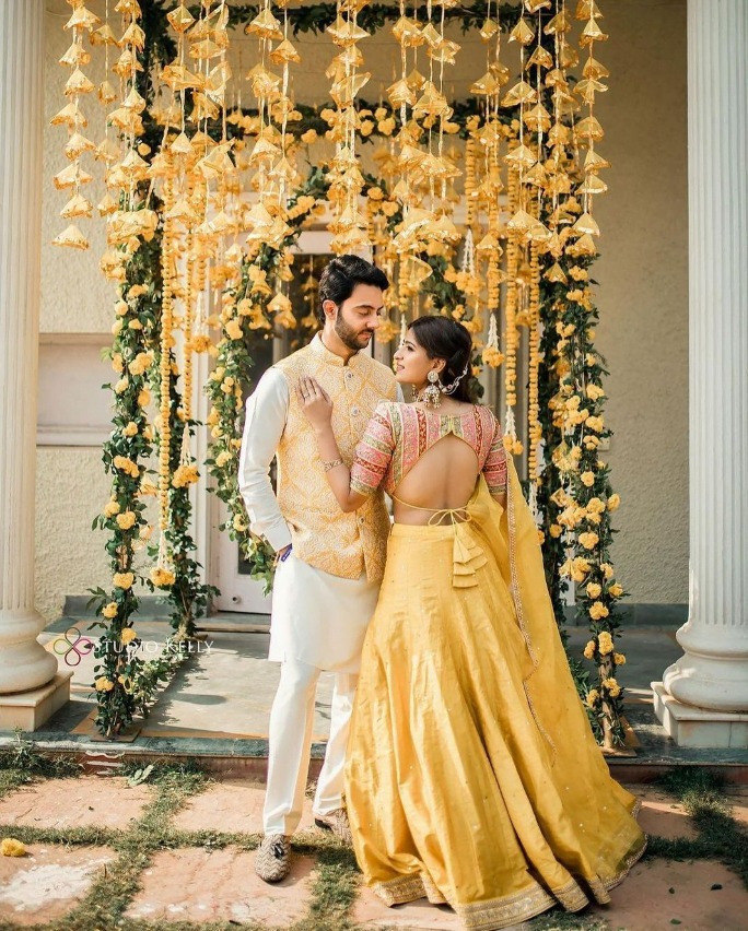 backdrop - haldi poses for bride and groom