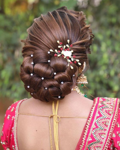 braided bun hairstyles for saree with pearls and flowers and curls