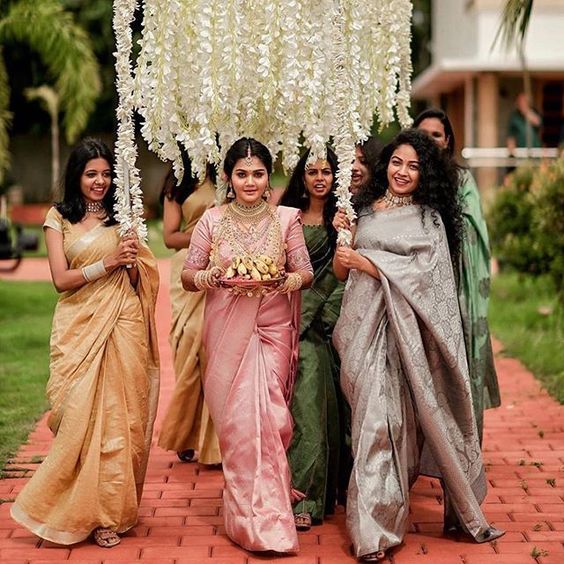 bridal entry under white flowers for south indian wedding decor