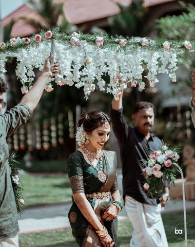 bridal entry under flowers for south indian wedding