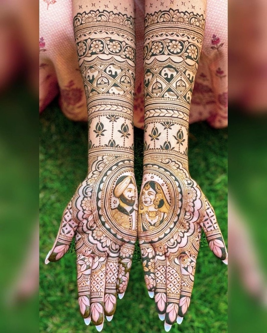 bride and groom figurines small elephants mehndi design