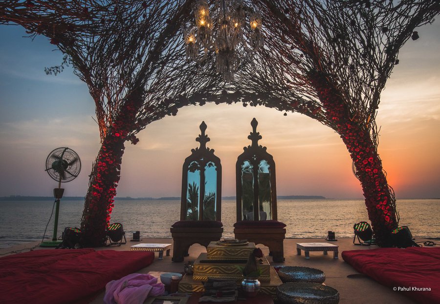 cove of branches and red roses for wedding mandap decoration