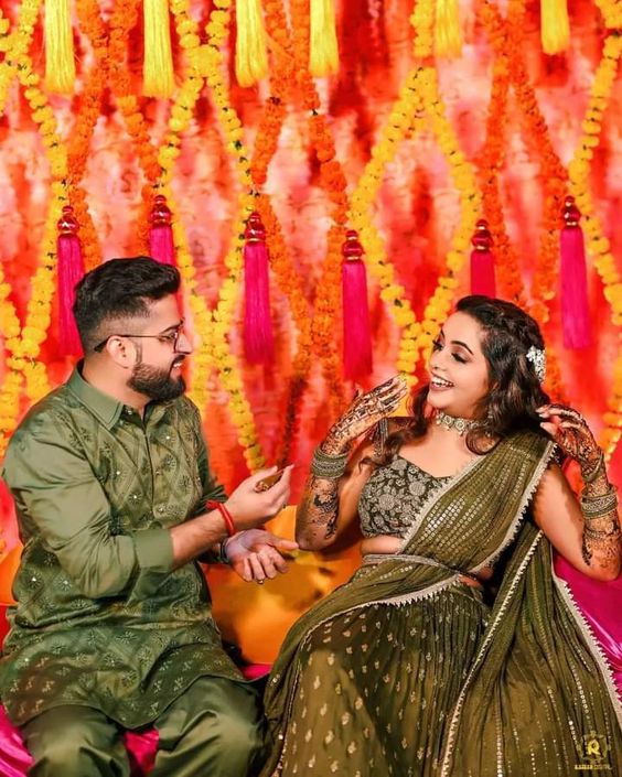 cute and wholesome mehndi poses of bride and groom