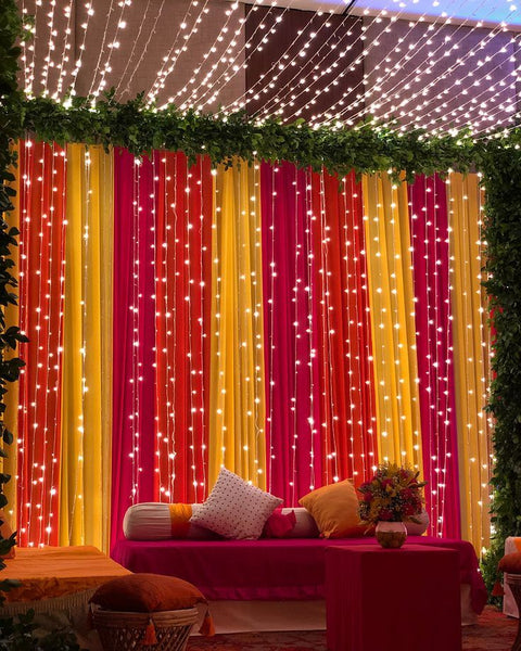 drapes and fairy lights for background haldi ceremony decoration