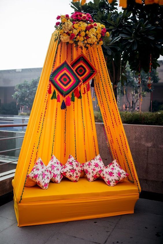 drapes canopy with hanging decorations for haldi ceremony