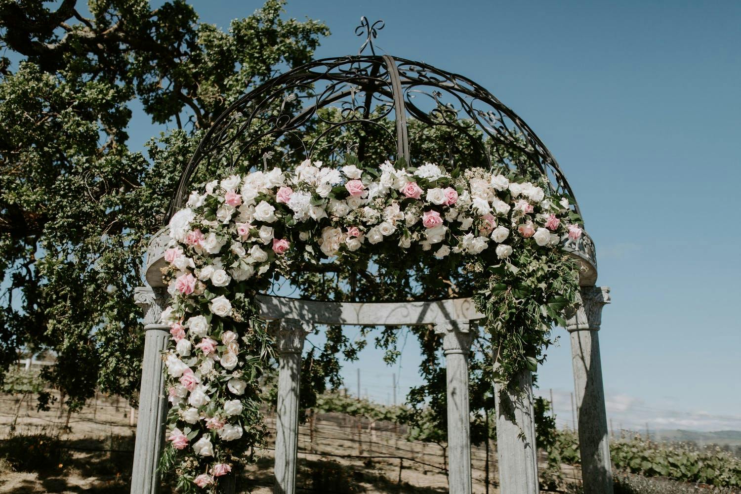 filigree ironwork and gardenscapes for wedding mandap decoration