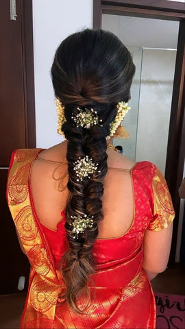 fishtail braid embellished with baby breaths hairstyles for saree