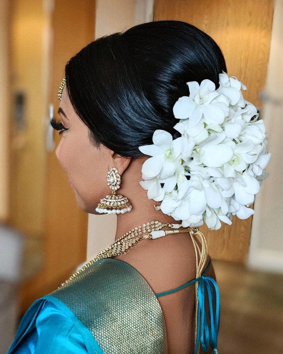 floral bun hairstyle for sangeet