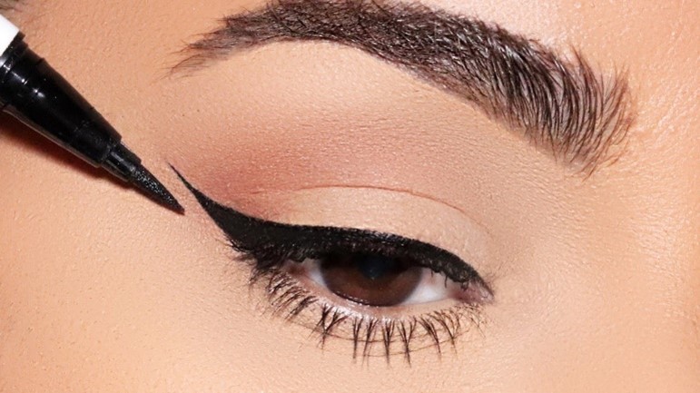 draw the eyeliner makeup slightly outer than the corner of the eye to have cat eye or a winged look