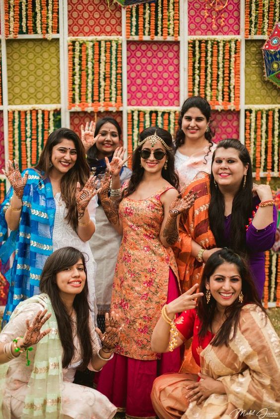 having fun with bridesmaids mehndi poses