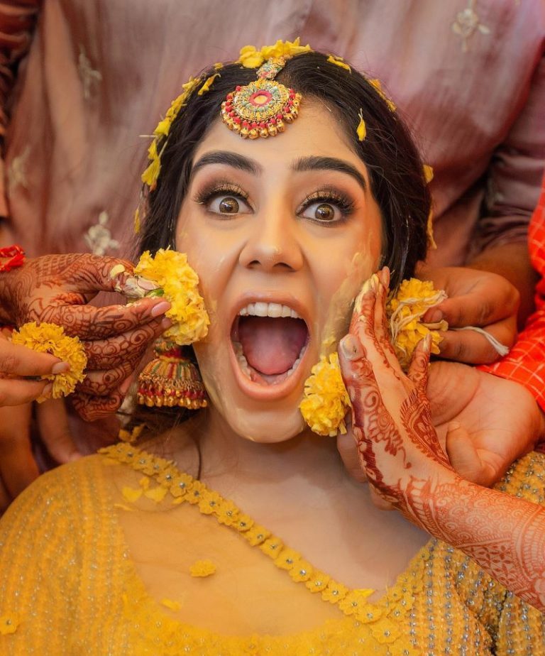 getting covered in haldi - haldi poses for bride