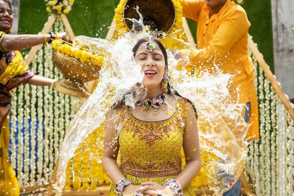 getting drenched - haldi poses for bride