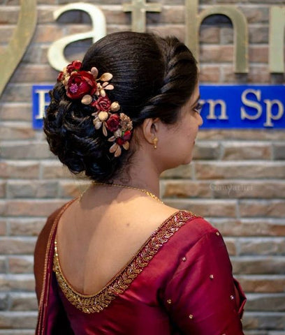 greek updo with flowers hairstyles for saree