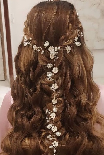 half pony braid lehenga hairstyles with accessories and flowers