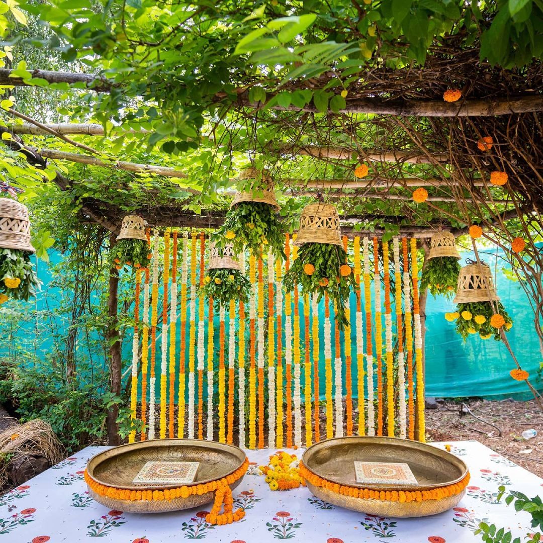 Background Haldi Decoration - hanging cane baskets