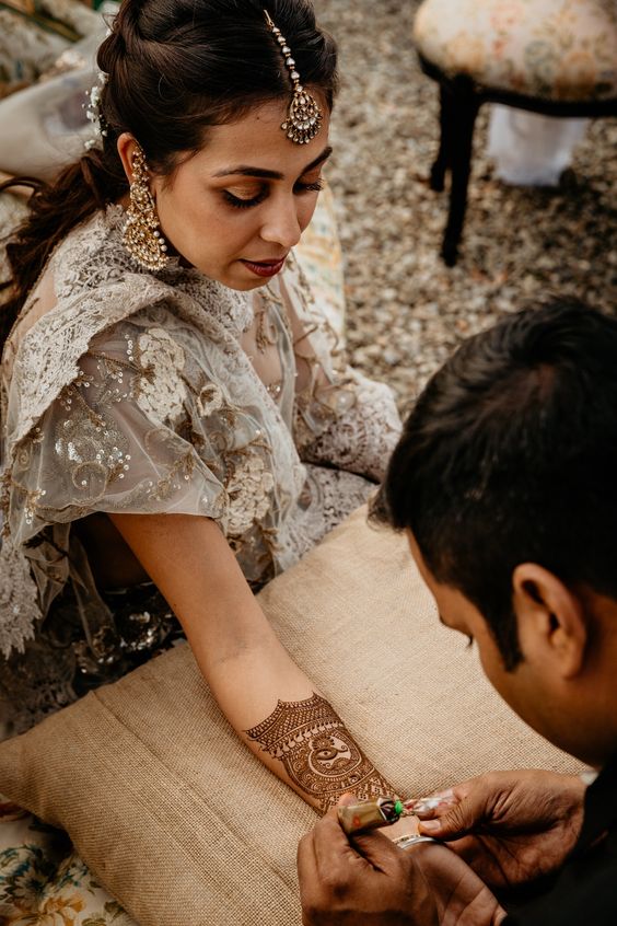 mehndi poses in the process for bride