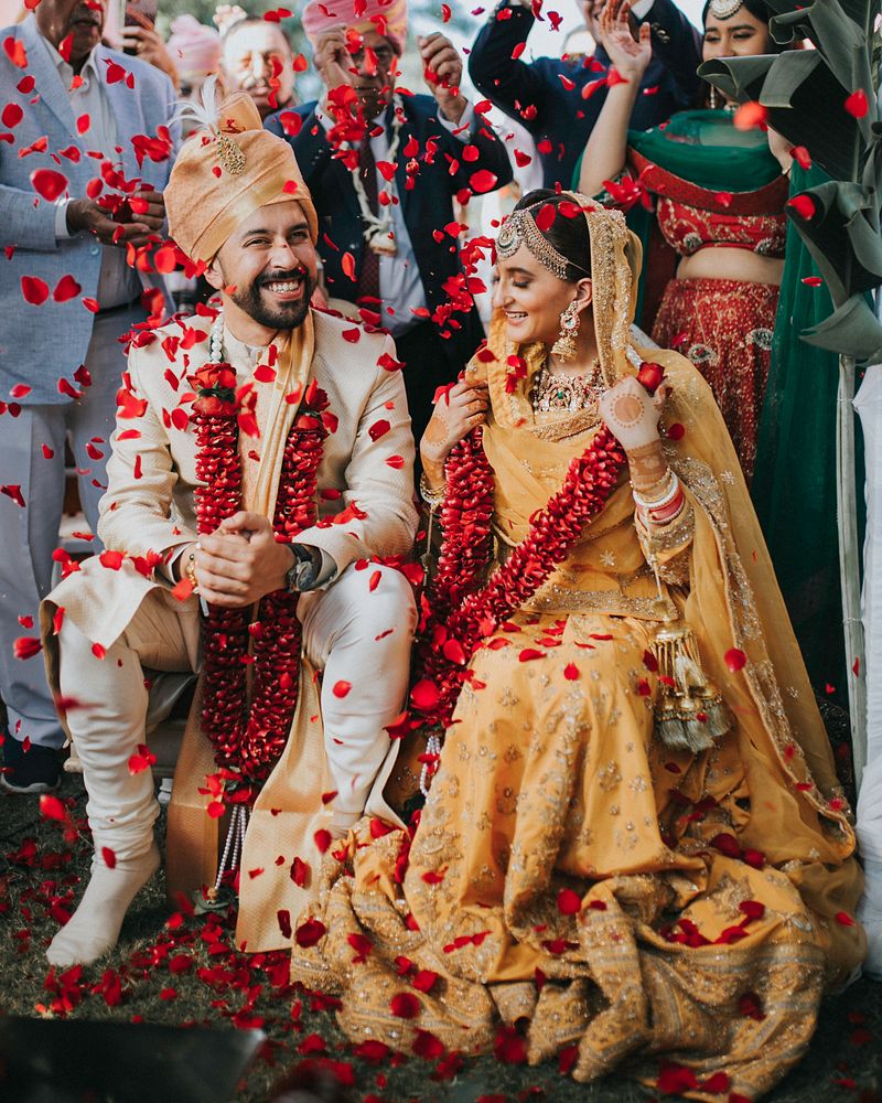 laughter under a flower shower - wedding photoshoot