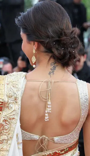 low twist bun - hairstyles for saree