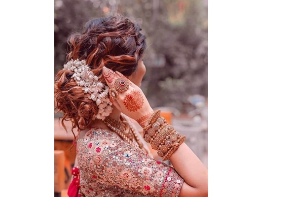 messy bun - Reception Hairstyles