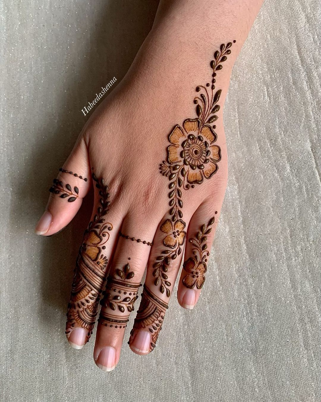 minimal back hand floral mehendi designs