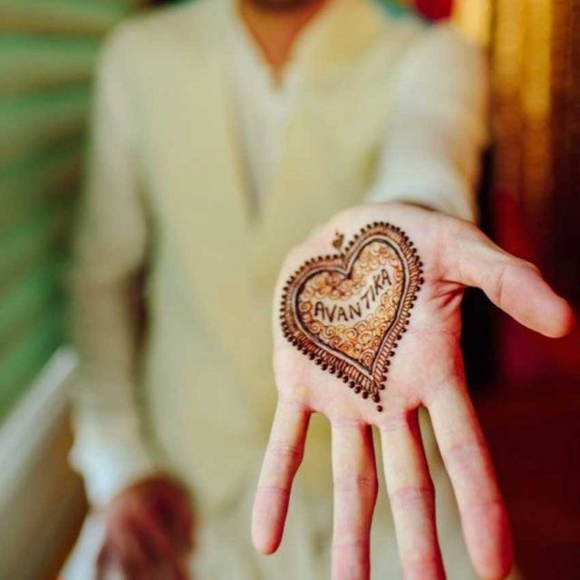 partner's name inside a heart for groom mehndi design