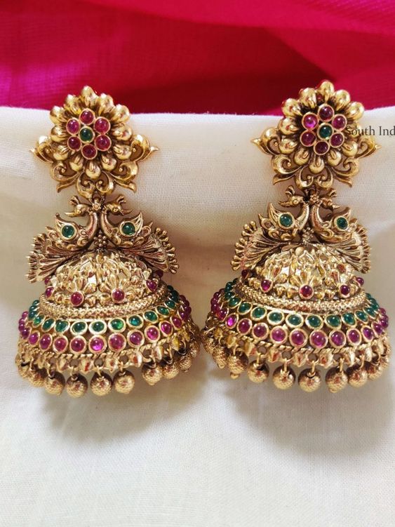 peacock and floral embellished gold jhumka design