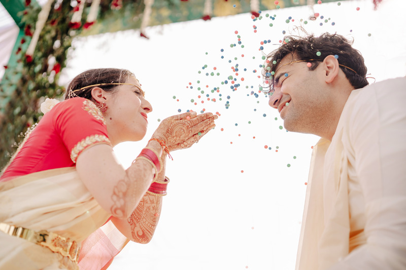 playful moment - haldi poses for bride and groom