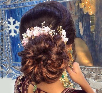 ringlet bun with flowers for easy wedding hairstyles