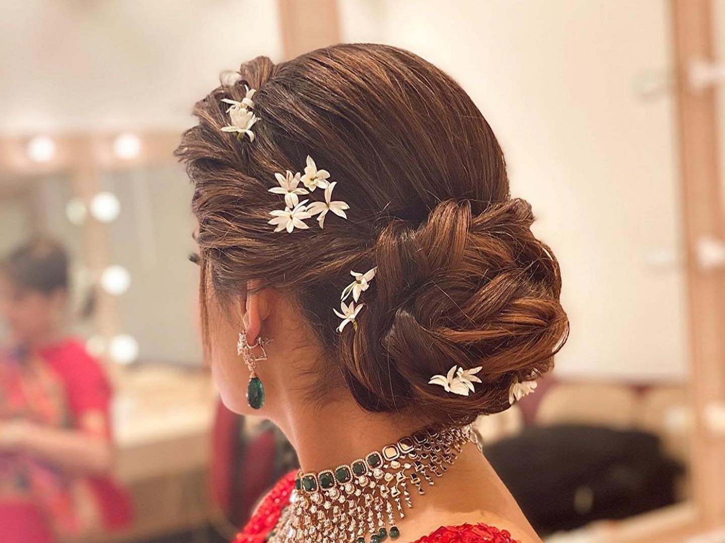 side braided bun lehenga hairstyles