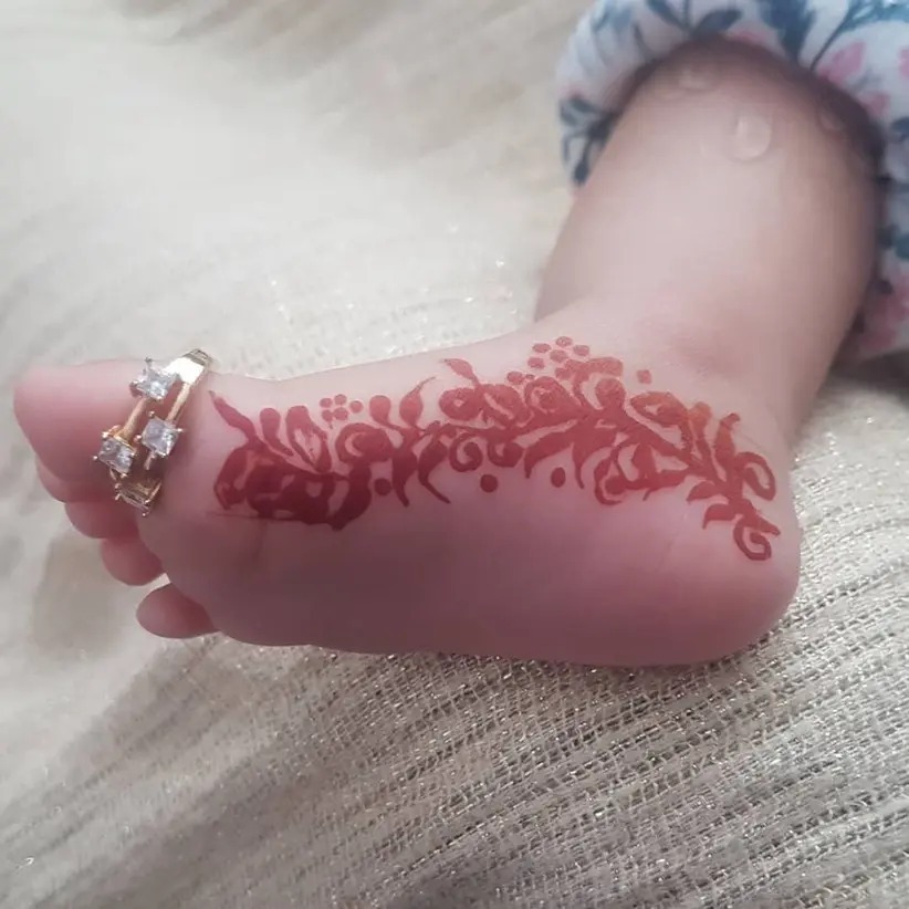 side feet floral and trails mehendi designs for kids