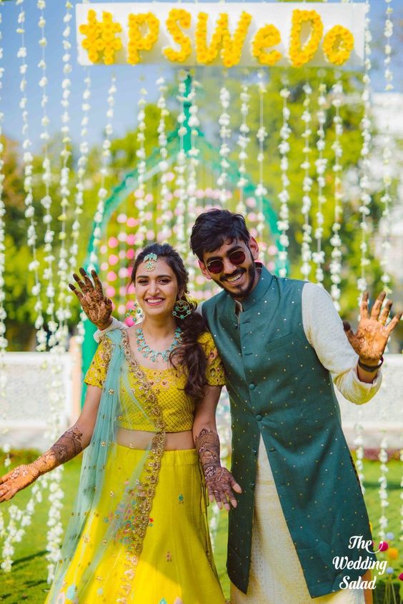 cute mehndi poses of bride and groom