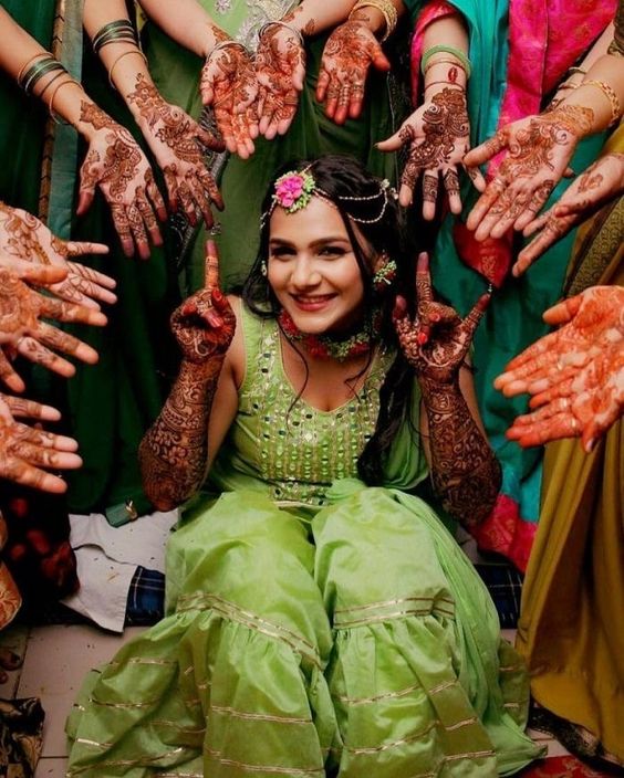 photo about bride surrounded with bridesmaids hands