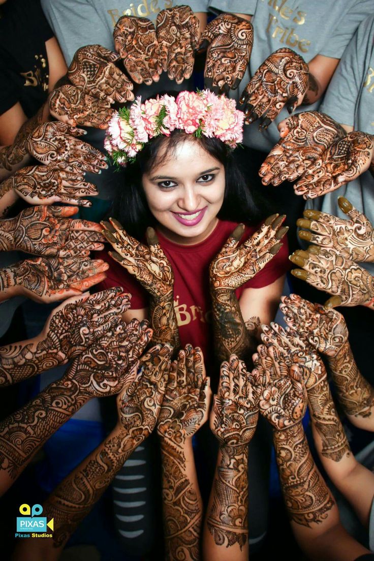 bride surrounded with hands mehndi poses