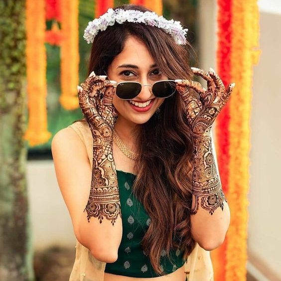 swaggy pose for mehndi ceremony with shades