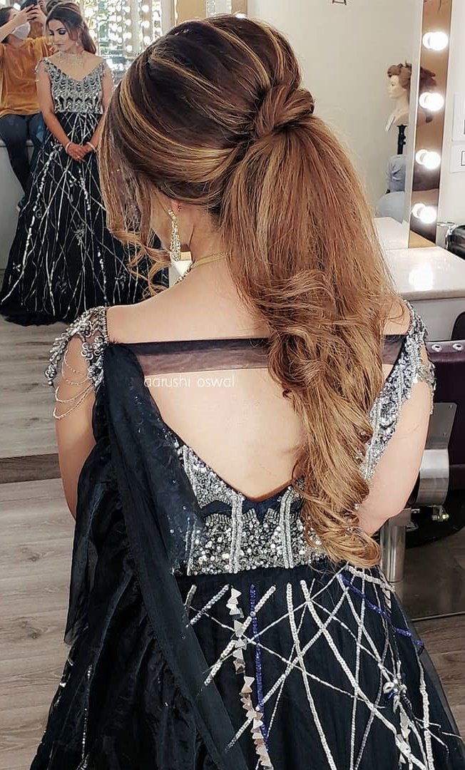 swirling ponytail hairstyle for sangeet