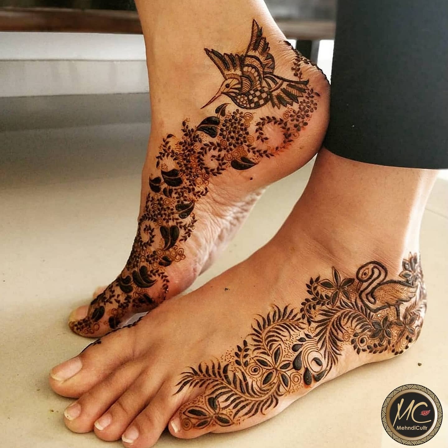 tattoo style leg mehndi designs with bird motifs