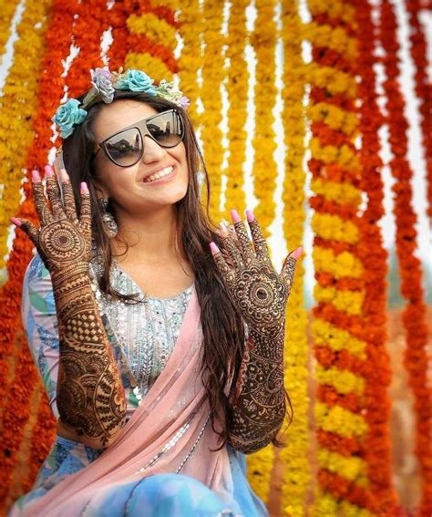 Mehndi Pose with flowers 