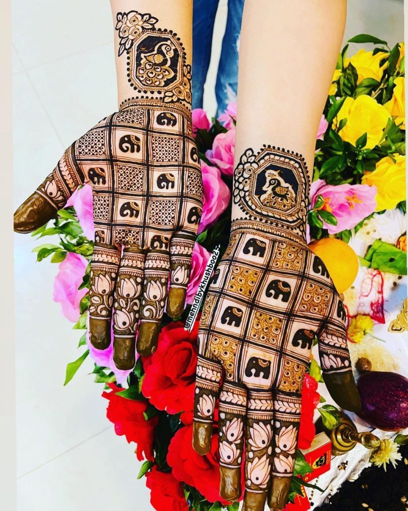 tiny elephants and peacock motifs elephant mehndi design