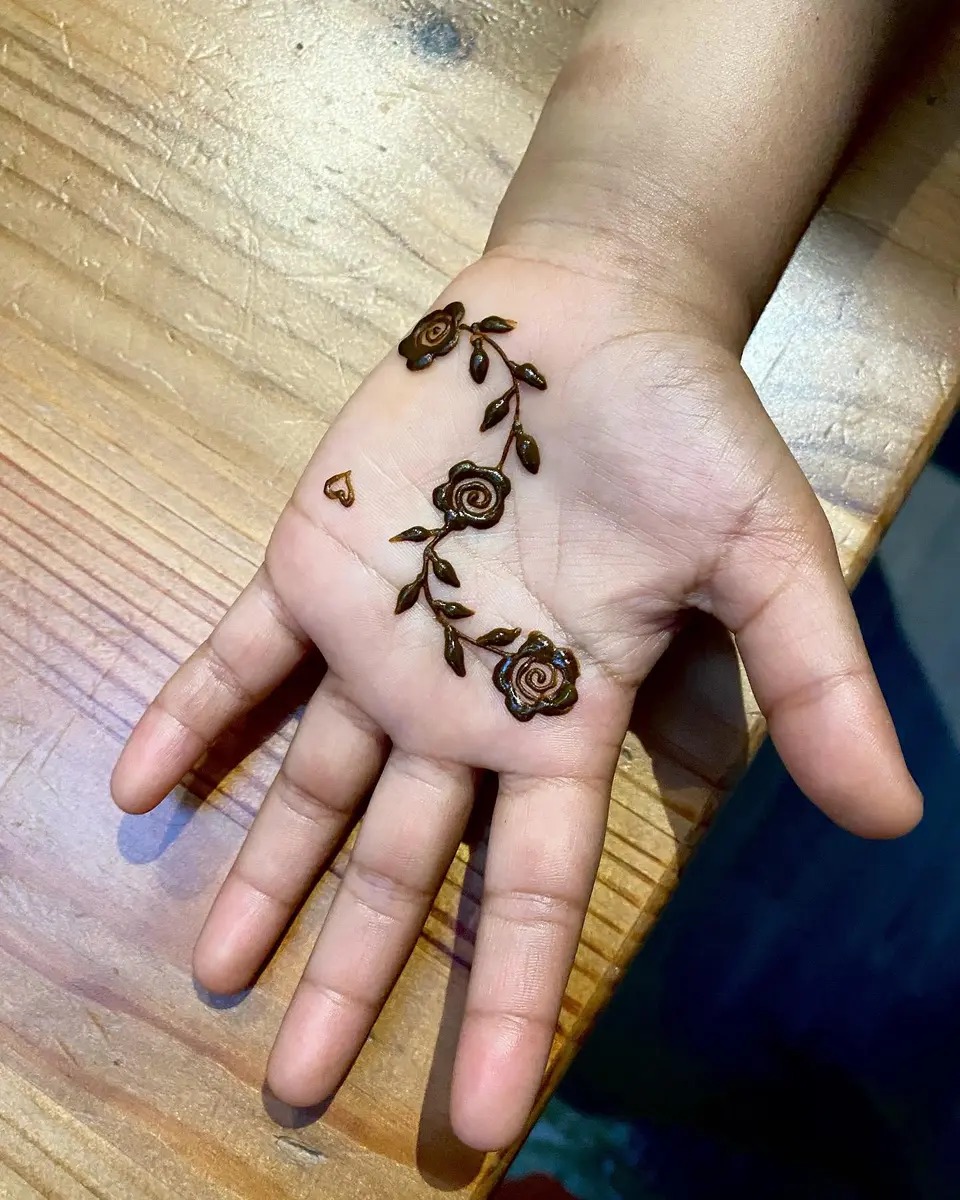 tiny floral small mehndi design with a leafy trail