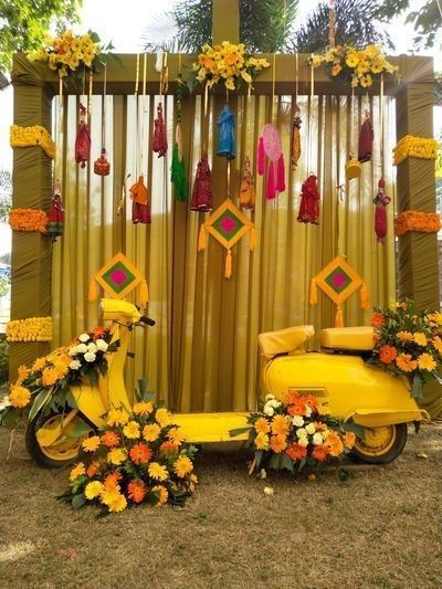 vintage photobooth with yellow scooter and tassels and dream catchers