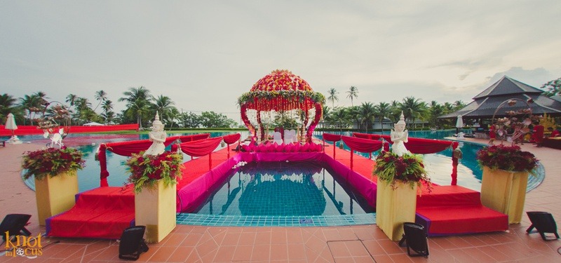 red wedding mandap decoration for poolside wedding