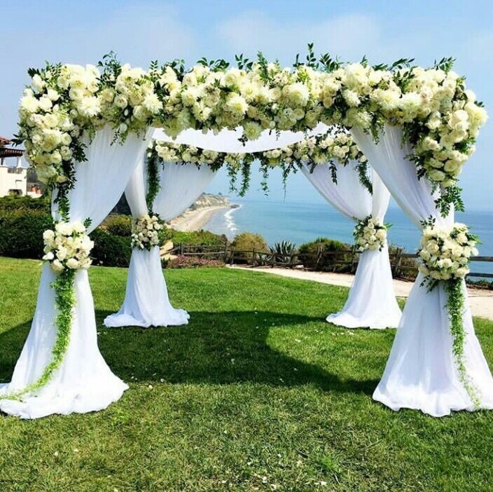 white floral dome and drapes for outdoor wedding mandap decoration