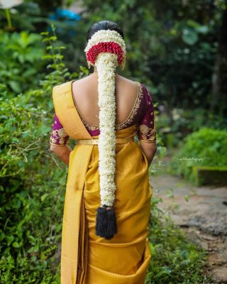 braid overflowed with white garlands